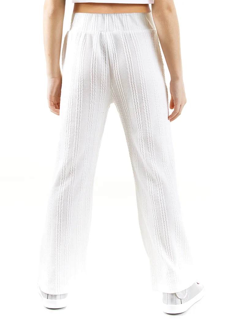 دينوكيدس بنطلون رياضي واسع للبنات بلون بيج فاتح